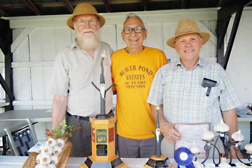 l-r This year's winning garlic growers Bill Kirby (overall champion) and Denis Craigen (reserve champion) with garlic guru Paul Pospisil at the annual Verona Garlic Festival that took place on September 5.